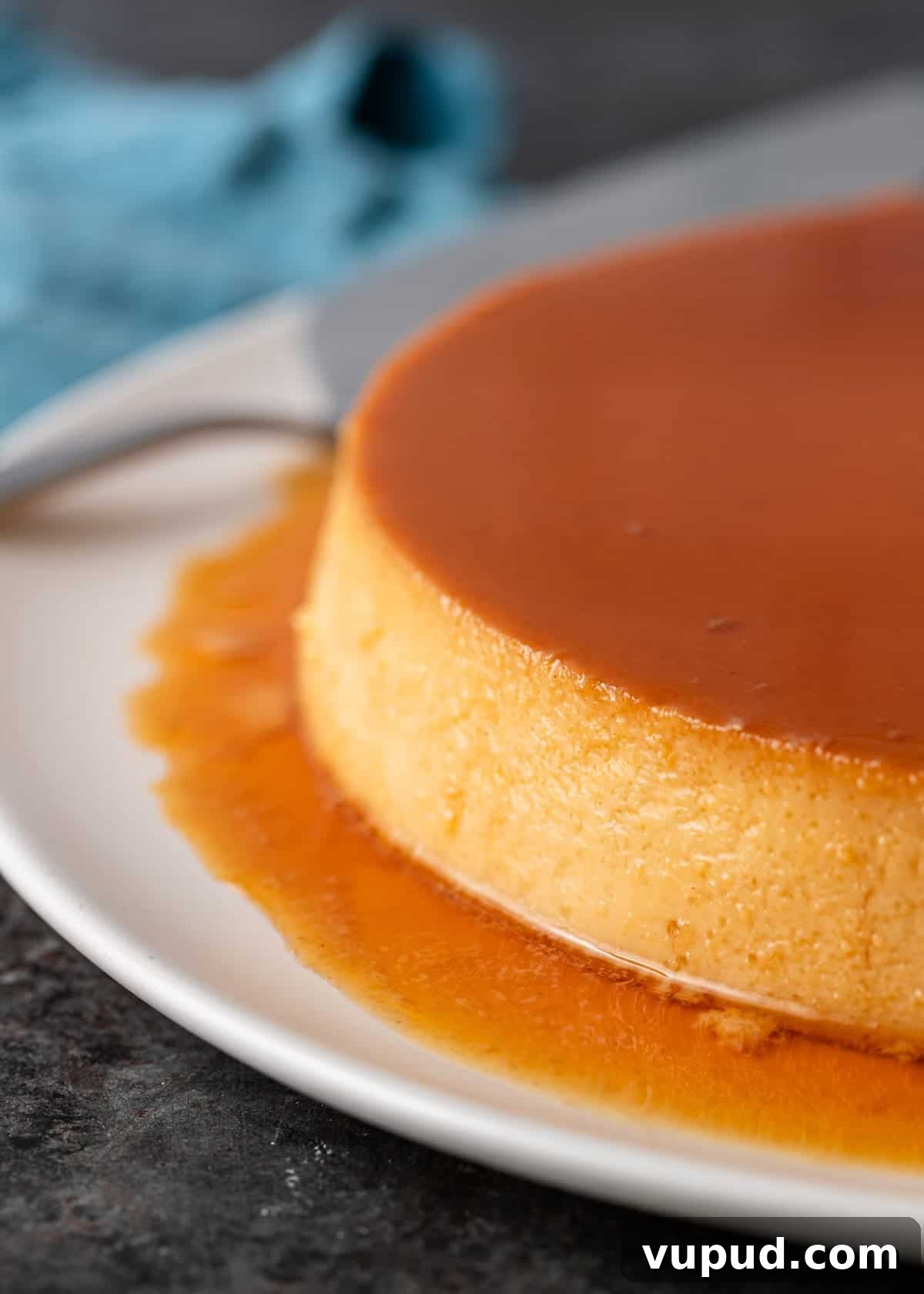 side view: baked Mexican flan recipe with caramel sauce