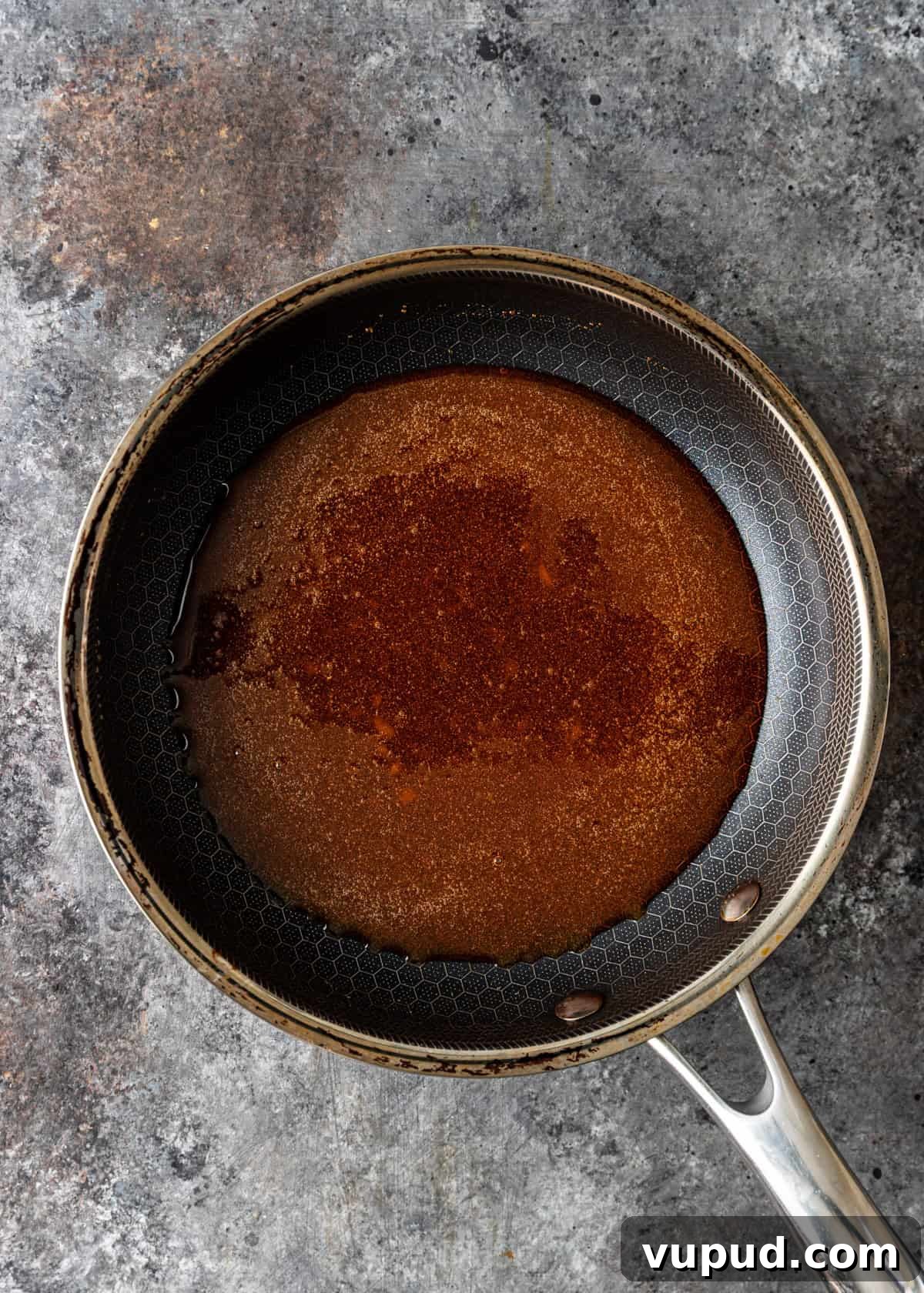 overhead process shot: sugar formed into a caramel sauce