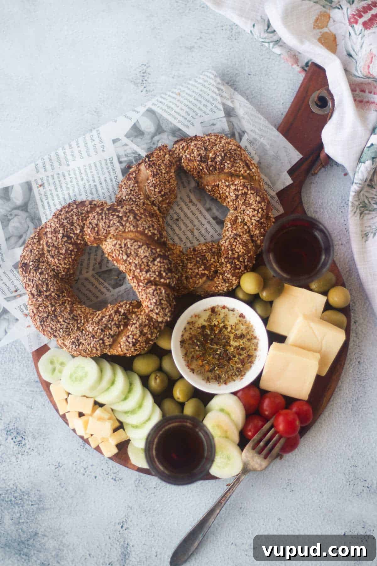 How to Make Turkish Simit: Crispy Bagel-Style Bread Recipe 2 grazing board with bread and accompaniments like cheese, tomato, olives and olive oil