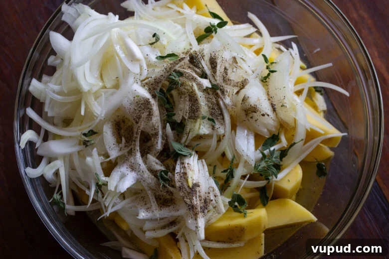 Authentic Greek Lemon Chicken Recipe with Crispy Roast Potatoes 5 Potatoes, onions, chicken broth, lemon juice and oregano are all mixed together before being placed on the bottom of a Dutch oven.