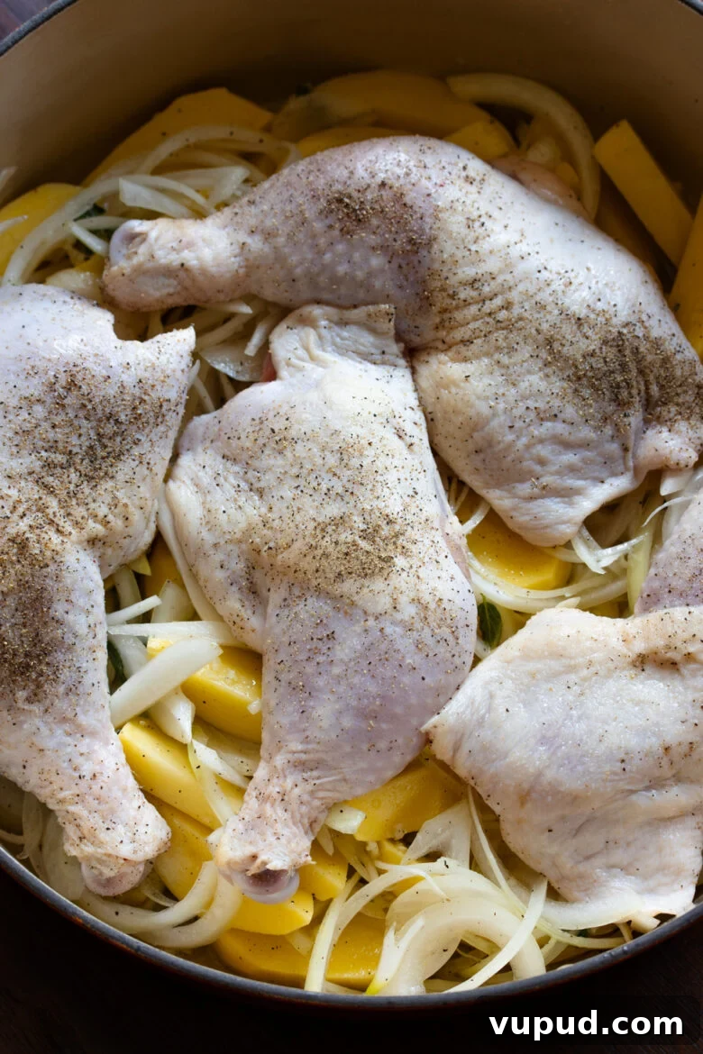 Authentic Greek Lemon Chicken Recipe with Crispy Roast Potatoes 6 Leg quarter well seasoned with salt and pepper and placed over the potatoes in a Dutch oven.