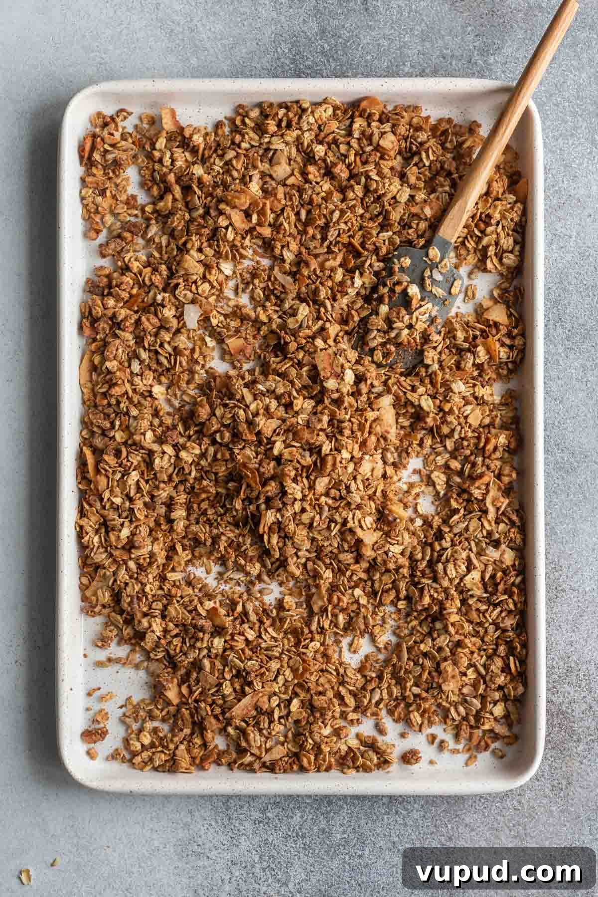 Maple Walnut Granola Recipe: Crunchy Homemade Clusters 6 Maple granola baked up golden brown on a baking sheet.