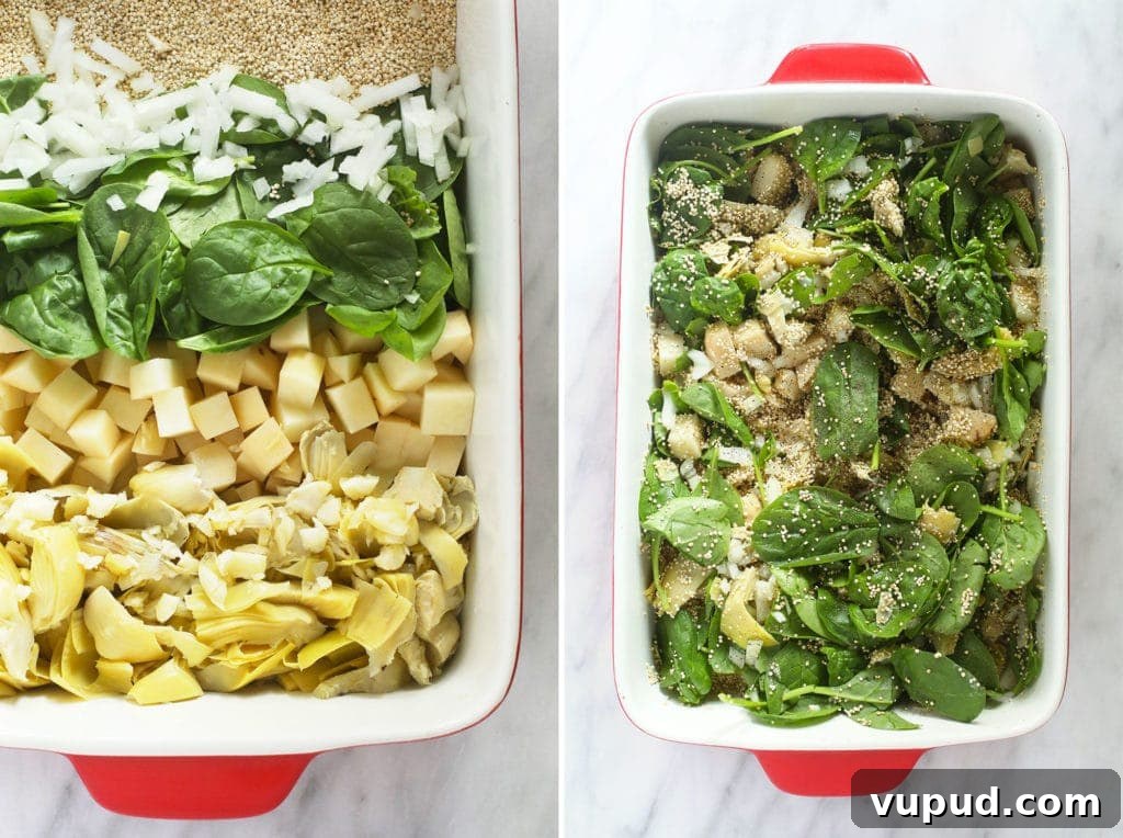 All of the ingredients of spinach artichoke quinoa casserole in a casserole dish. 