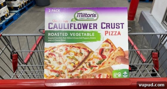 Top Costco Thanksgiving Appetizers for 2025 Holiday Hosting 11 Milton’s Cauliflower Pizza from Costco cut into appetizer squares — gluten-free Costco Thanksgiving food.