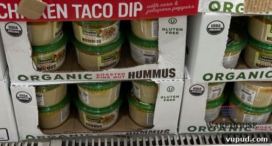 Top Costco Thanksgiving Appetizers for 2025 Holiday Hosting 12 Kirkland Signature Hummus from Costco with pita and veggies — simple healthy Costco Thanksgiving appetizer.