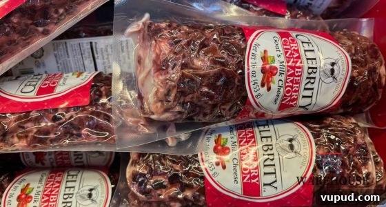 Top Costco Thanksgiving Appetizers for 2025 Holiday Hosting 7 Celebrity Cranberry Goat Cheese log from Costco sliced with crackers — festive Costco Thanksgiving appetizer.