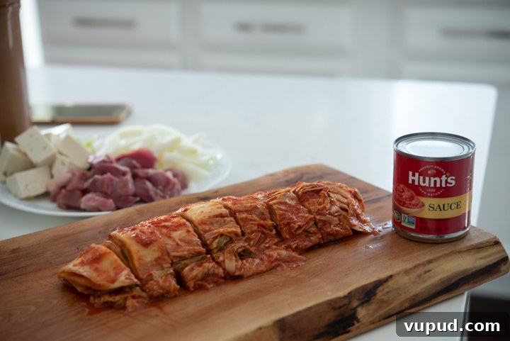 Tomato Kimchi Stew Recipe: Savory Korean Tomato-Kimchi Jjigae 3 Sliced kimchi and a can of tomato sauce.