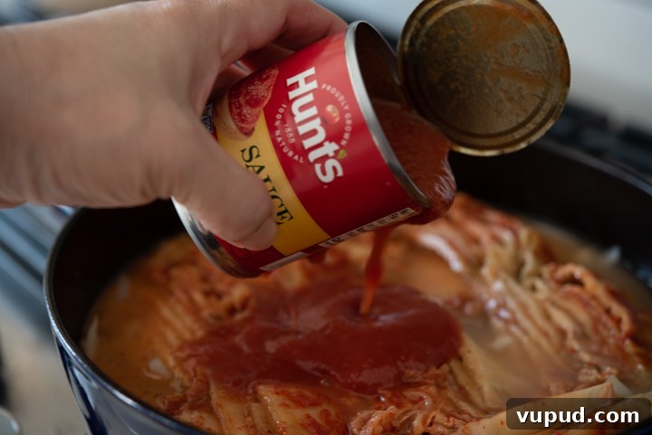 Tomato Kimchi Stew Recipe: Savory Korean Tomato-Kimchi Jjigae 7 Tomato sauce added to kimchi mixture.