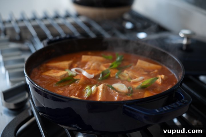Tomato Kimchi Stew Recipe: Savory Korean Tomato-Kimchi Jjigae 9 Tomato kimchi jjigae simmering.