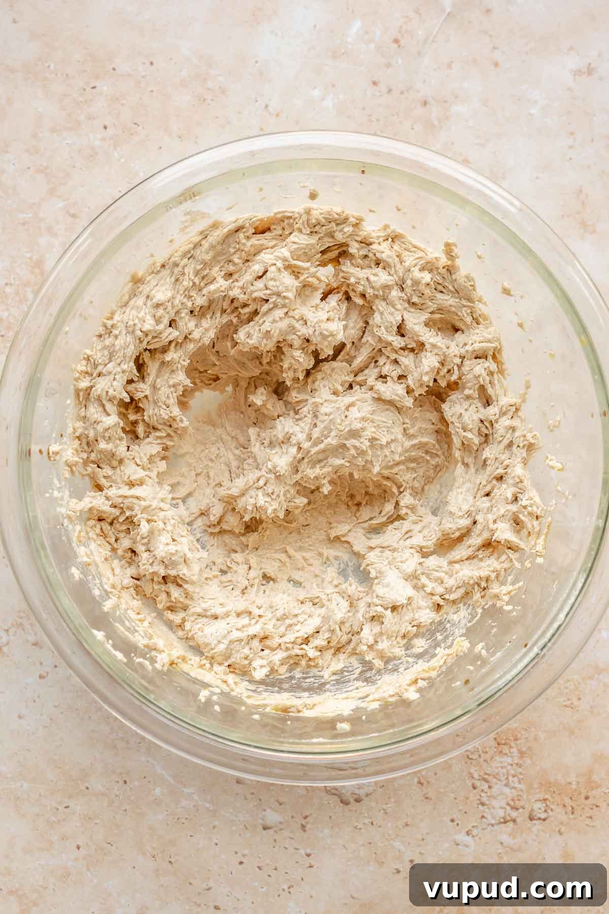 Chewy Coconut Pecan Cookies Recipe for Crispy Edges and Gooey Center 7 Creamed cookie dough in a bowl.