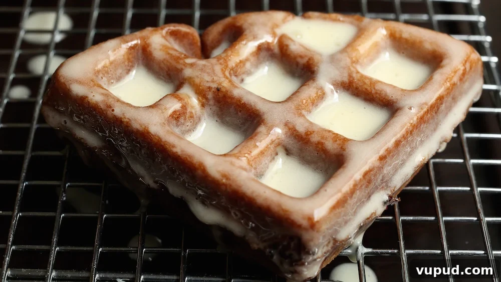 Apple Fritter Waffle Donuts Recipe: Crisp, Cinnamon-Glazed Treats 4 An Apple Fritter Waffle Donut on a cooling rack after being glazed.