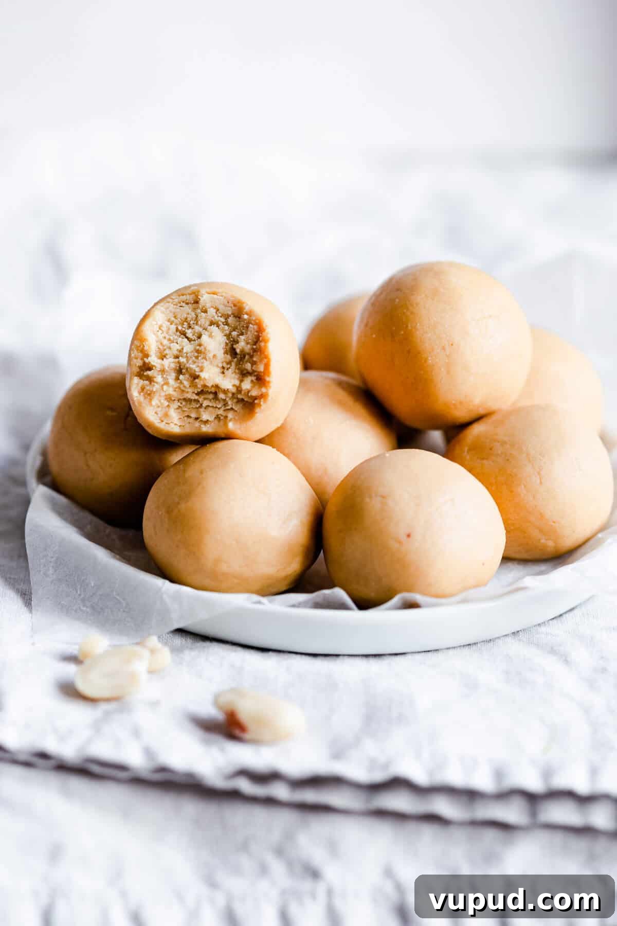 Peanut Butter Energy Balls: 3-Ingredient No-Bake Snack 6 side angle of energy balls on a small plate