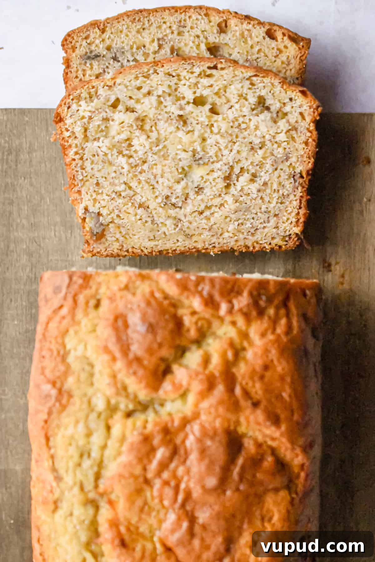 4-Ingredient Banana Bread from Cake Mix — Quick Recipe 10 An overhead shot of a loaf of cake mix banana bread.