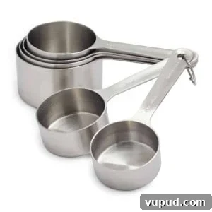 Top Kitchen Gifts for Home Cooks and Food Lovers 32 Front view of a set of metal measuring cups