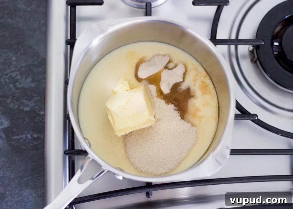 Chocolate Orange Caramel Shortbread Recipe — Zesty Caramel Slice 10 Caramel ingredients in a saucepan on the hob