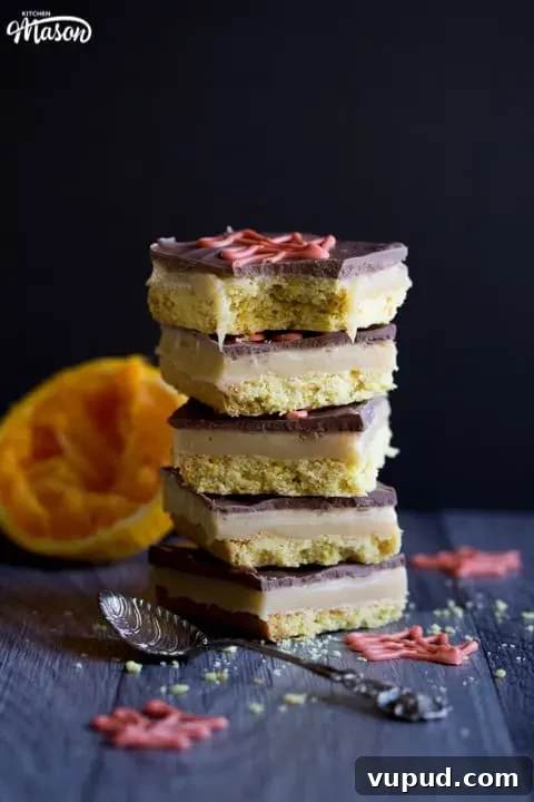 Chocolate Orange Caramel Shortbread Recipe — Zesty Caramel Slice 15 Chocolate Orange Caramel Shortbread in a stack