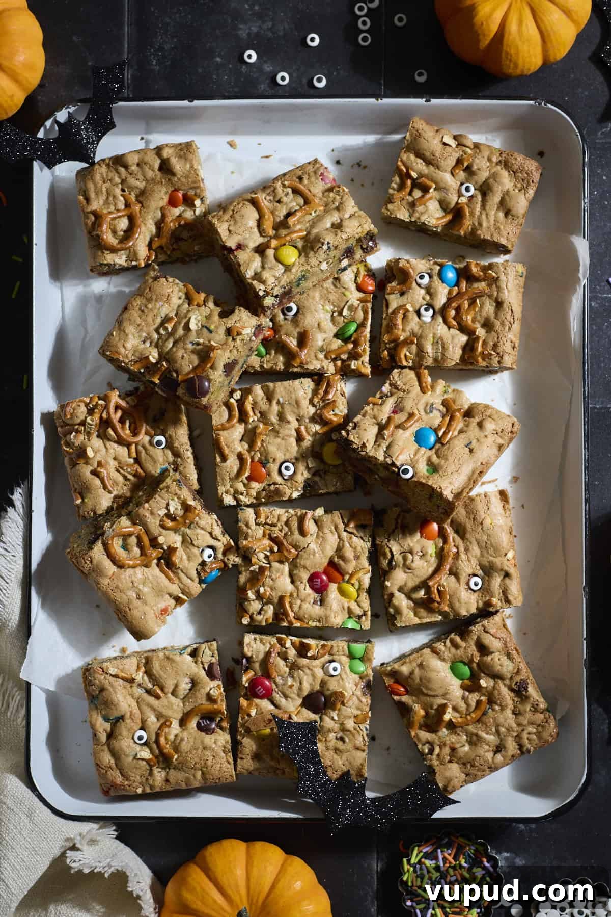 Halloween Sourdough Discard Kitchen Sink Cookie Bars 9 Sliced cookie bars on a white tray.