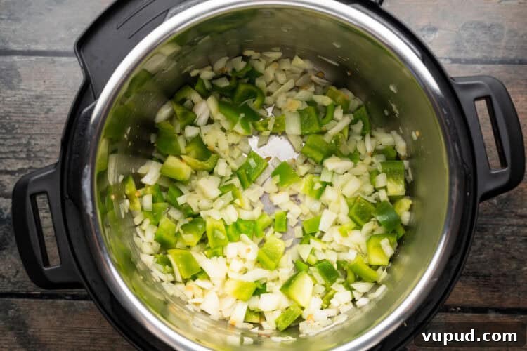 Ultimate Instant Pot Paella: Quick Spanish Rice & Seafood Recipe 6 Overhead view of paella ingredients in an Instant Pot.