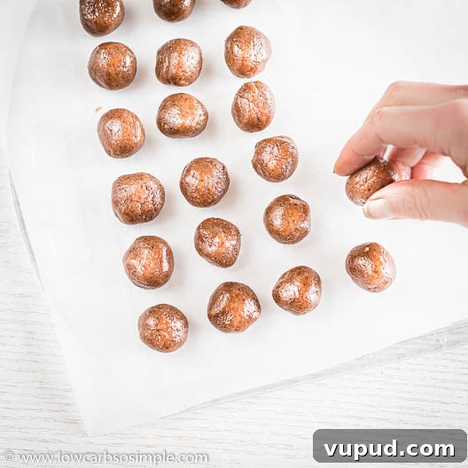 Keto Pumpkin Spice Cookie Dough Bites for Fall Snacking 16 Placing on the Parchment Paper | Low-Carb, So Simple
