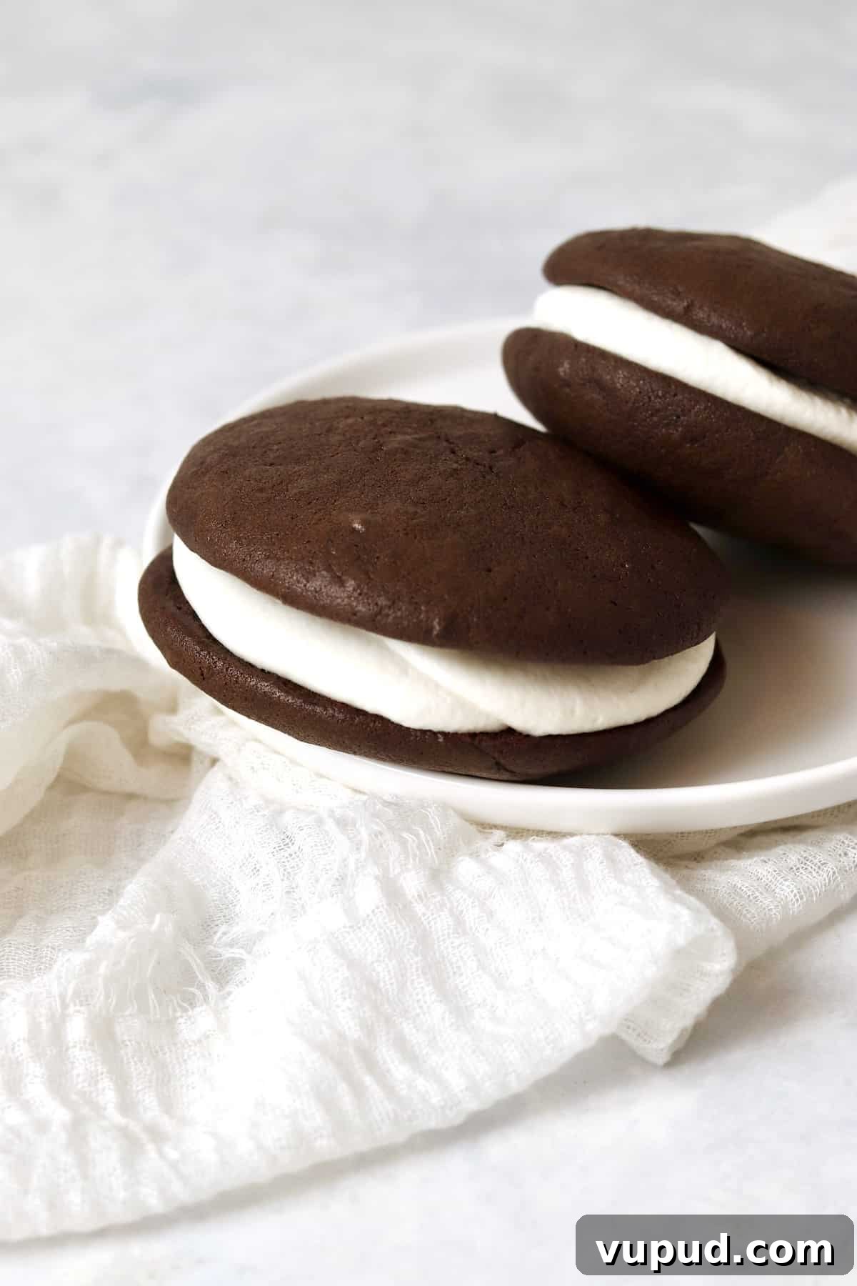 Mini Whoopie Pie Recipe for One — Small Batch Dessert 2 Stack of two chocolate whoopie pies with marshmallow filling.