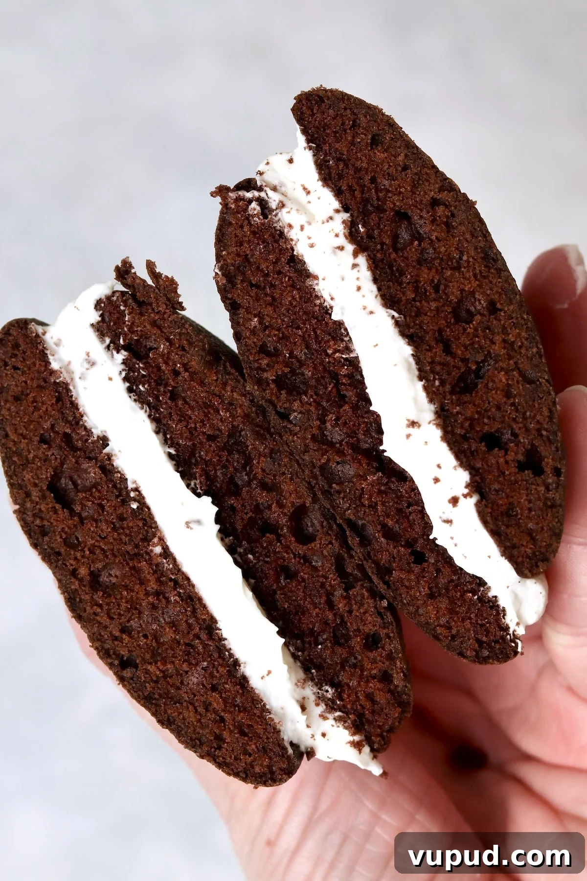 Mini Whoopie Pie Recipe for One — Small Batch Dessert 12 Single serve chocolate whoopie pie cut in half to show filling.