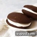 Single serve whoopie pie with marshmallow filling on a plate.