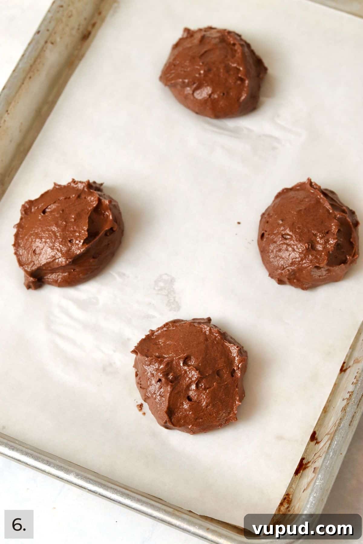 Mini Whoopie Pie Recipe for One — Small Batch Dessert 9 Four dollops of whoopie pie batter on a baking sheet.