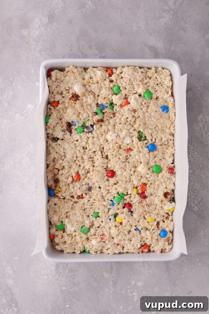 M&M Rice Krispie Treats Recipe: Colorful No-Bake Snack 11 A large white pan filled with M&M Rice Krispie Treats.