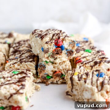 M&M Rice Krispie Treats Recipe: Colorful No-Bake Snack 14 Chocolate covered rice krispie treats with M&Ms cut into squares.
