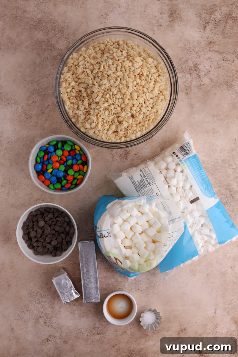 M&M Rice Krispie Treats Recipe: Colorful No-Bake Snack 4 Bowls of Rice Krispies, M&Ms, chocolate chips, butter, and bags of mini marshmallows.
