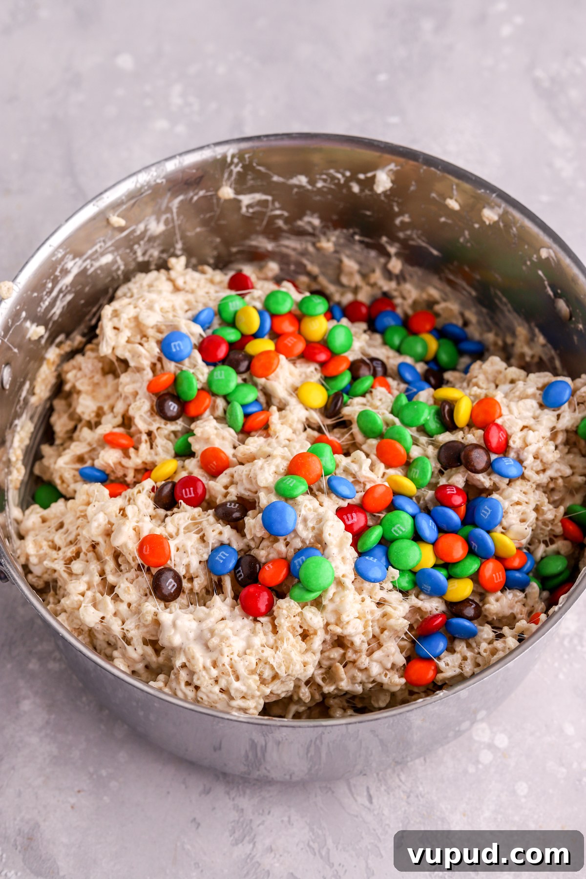 M&M Rice Krispie Treats Recipe: Colorful No-Bake Snack 9 A pot with Rice Krispie treats with M&Ms on top.