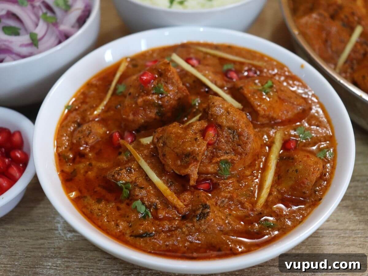 Dishoom’s Chicken Ruby Recipe: Rich Bombay-Style Chicken Curry 2 close-up of dishooms chicken ruby served in a white bowl.