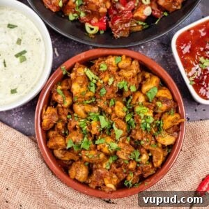 Indian Mushroom Bhaji Recipe: Flavorful Mushroom Curry Guide 3 Mushroom curry in a tapas dish with mint raita, chilli paneer and mango chutney on the side