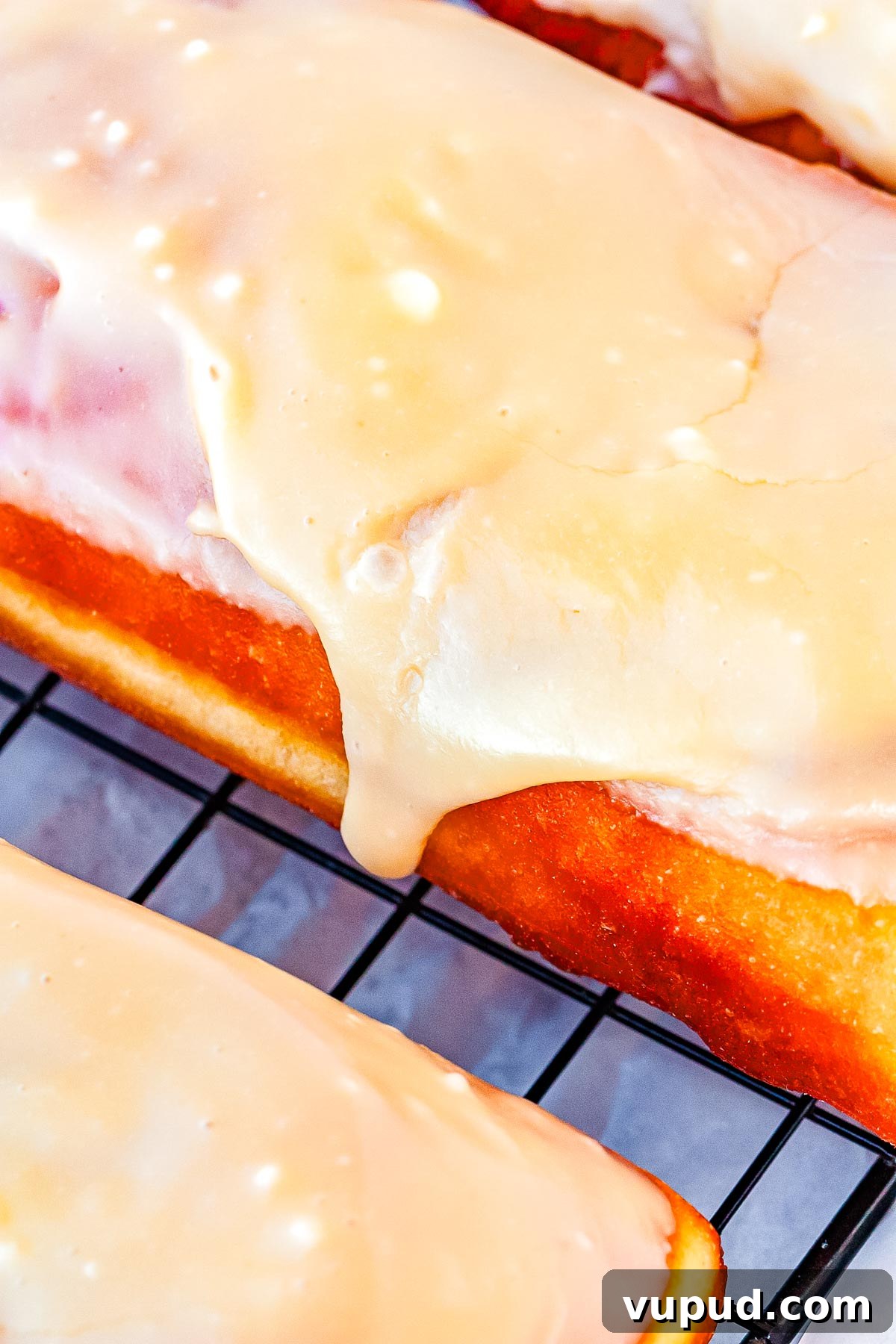 Classic Maple Bar Donut Recipe: Soft, Glazed, and Irresistible 3 The maple bars on a wire rack after the glaze has been applied.