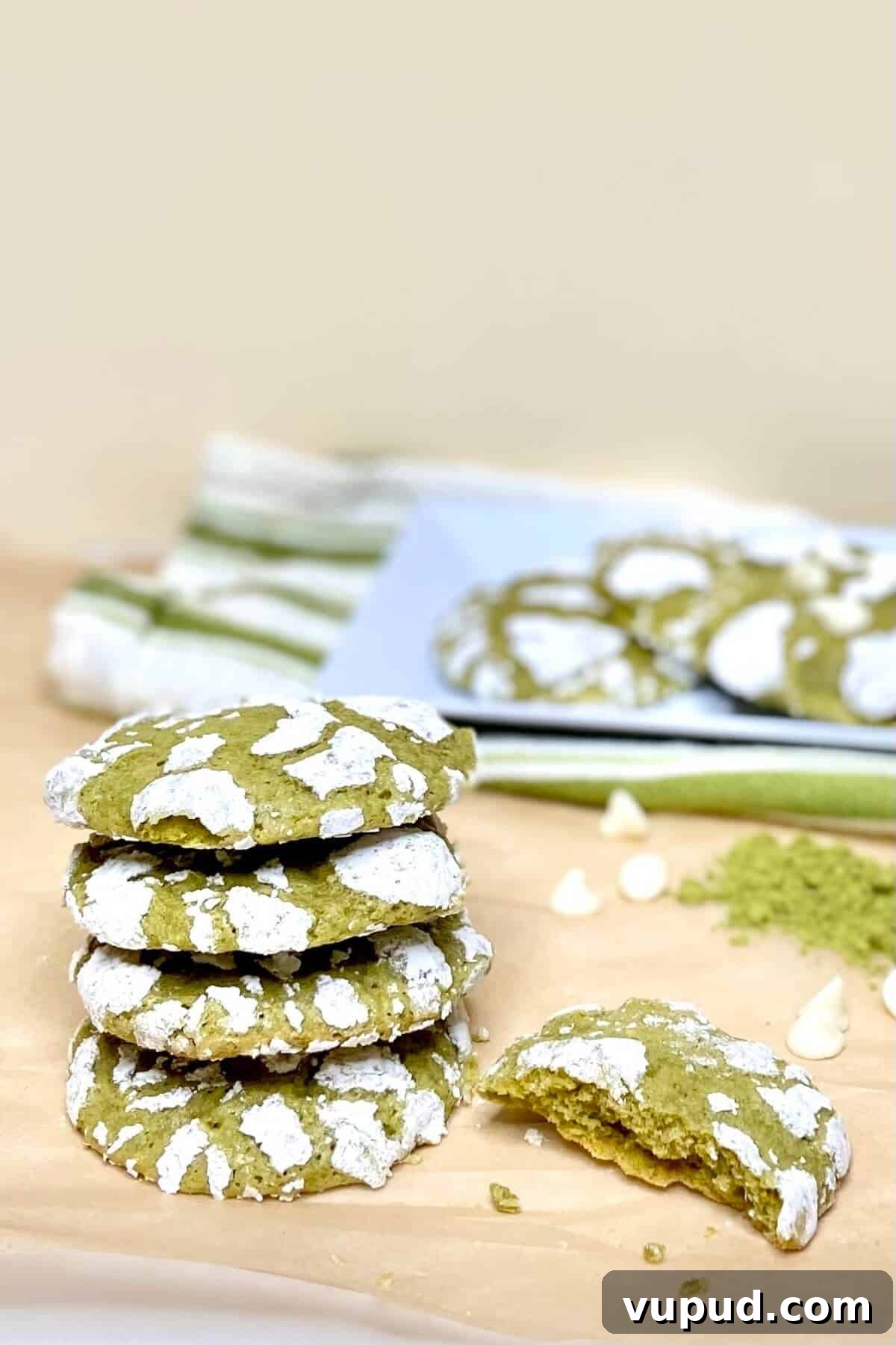 Matcha Crinkle Cookies Recipe: Soft, Chewy Green Tea Cookies 10 Stack of cookies, with one half eaten.