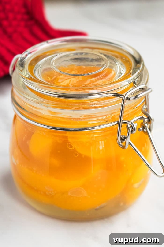 Homemade Filling in a Sealed Jar on White Marble Background.