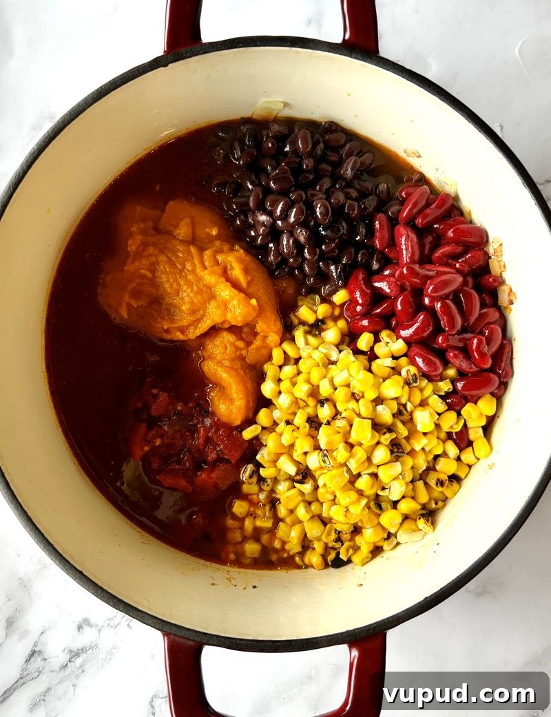 Pumpkin Turkey Chili Recipe for Cozy Fall Dinners 4 Adding ingredients