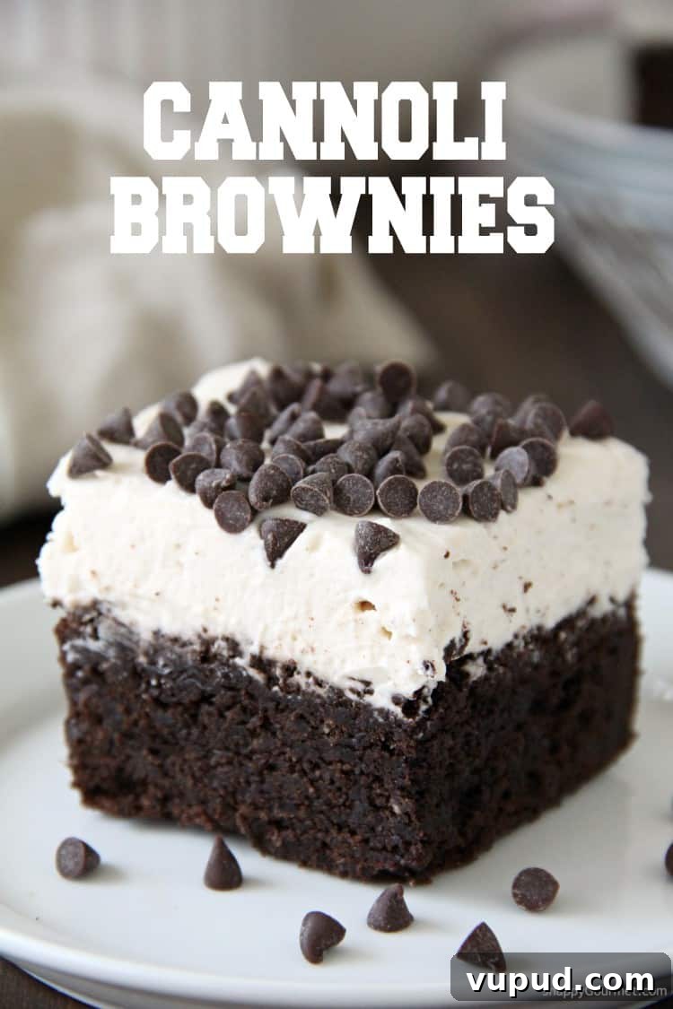 Cannoli Brownies - gourmet fudgy brownie recipe with Cannoli Frosting Cannoli Brownie with frosting and chocolate chips on plate