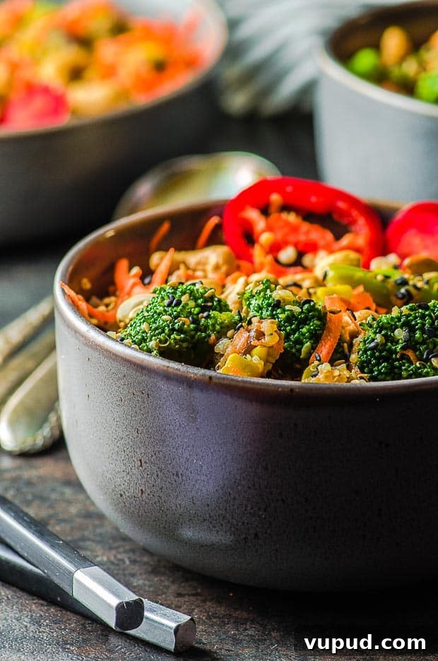 Veggie-Packed Quinoa Fried Rice Recipe for Flavorful Meals 2 A close up view of a bowl of Veggie Loaded Quinoa Fried Rice