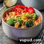 Side view of a gray bowl filled with quinoa fried rice