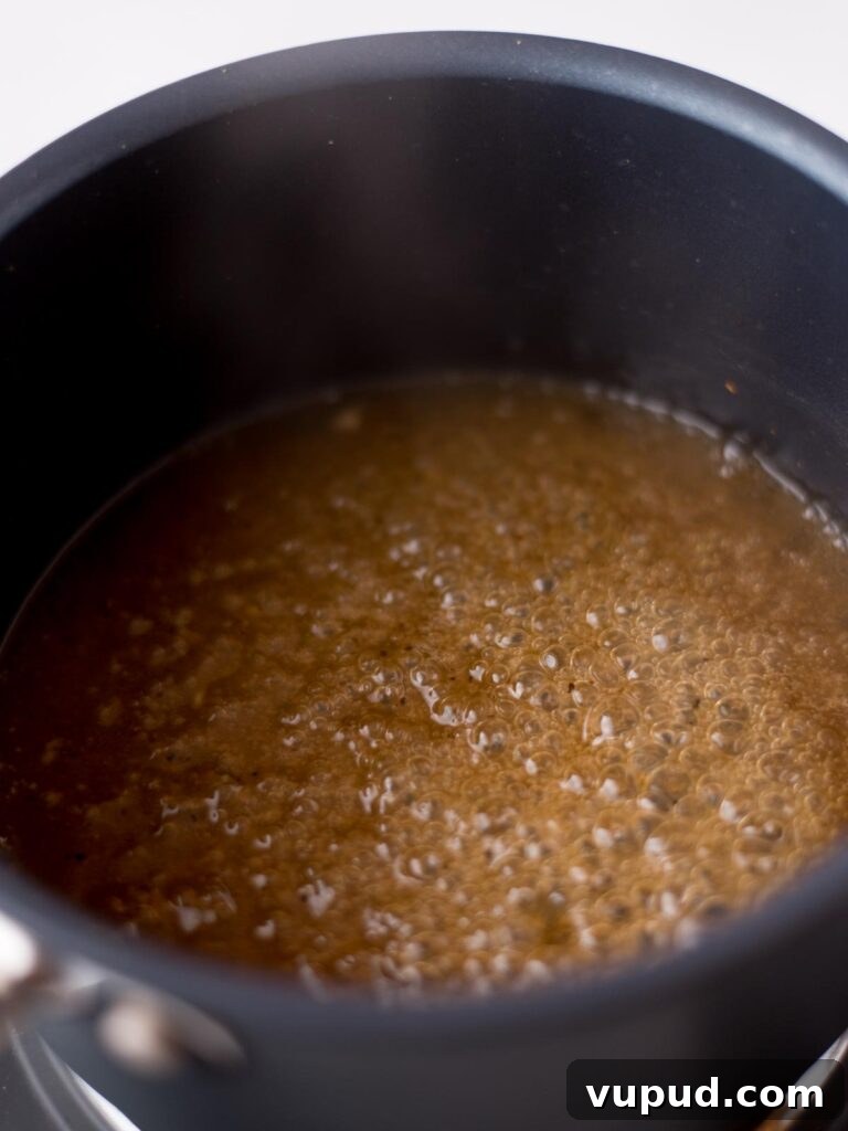 Tequila-Lime Chicken Wings: Zesty Grilled Wing Recipe 8 Tequila glaze simmering in a saucepan.
