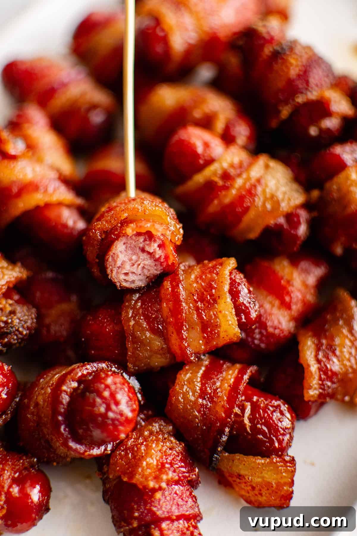 Smoky Bacon-Wrapped Cocktail Sausages Recipe 4 bacon wrapped smokies with toothpick