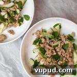 Spicy Chicken Salad with Fresh Mint and Citrus Dressing 2 Two plates of chicken salad with mint.