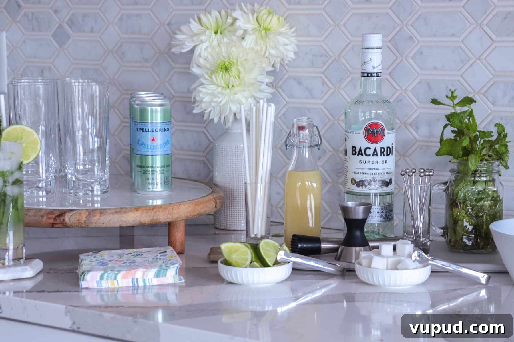 Mint Mojito Bar Ideas for Parties: DIY Setup & Refreshing Recipes 2 Mojito bar set up with rum, sugar cubes and lime juice.