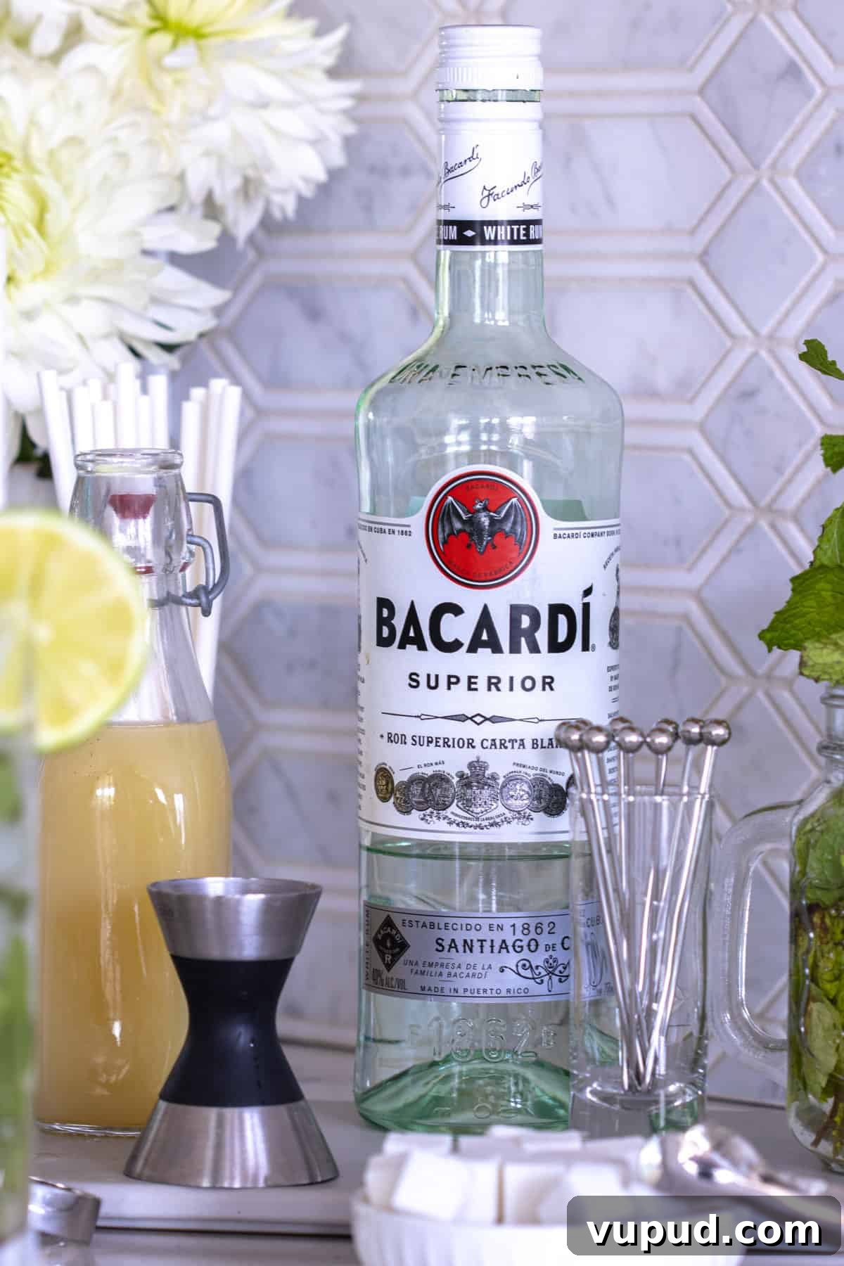 Mint Mojito Bar Ideas for Parties: DIY Setup & Refreshing Recipes 7 Bacardi bottle on counter.