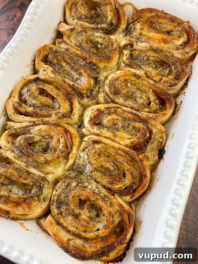 Quick Ham and Cheese Roll-Ups: 4-Ingredient Party Snack 2 Warm ham roll-ups with glaze baked in 9x13 pan