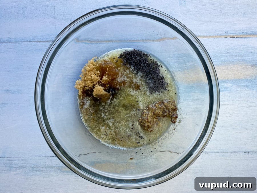 Quick Ham and Cheese Roll-Ups: 4-Ingredient Party Snack 13 Melted butter, brown sugar, poppyseeds, mustard & Worcestershire sauce in bowl to make glaze