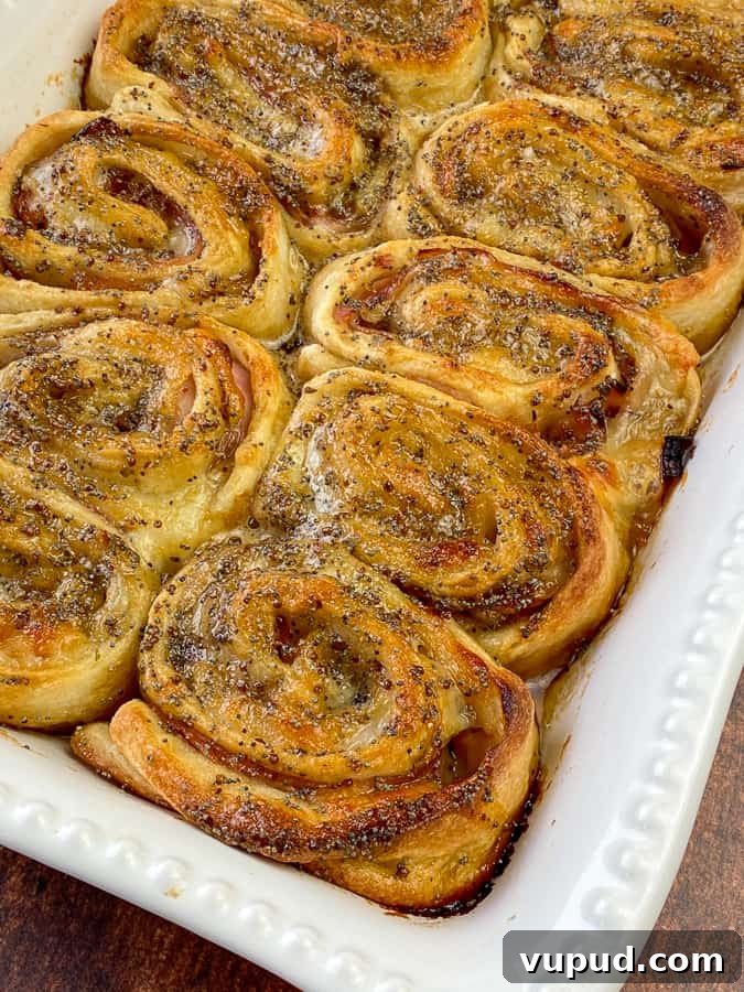 Quick Ham and Cheese Roll-Ups: 4-Ingredient Party Snack 6 Baked ham and cheese roll-up with thin crust pizza dough