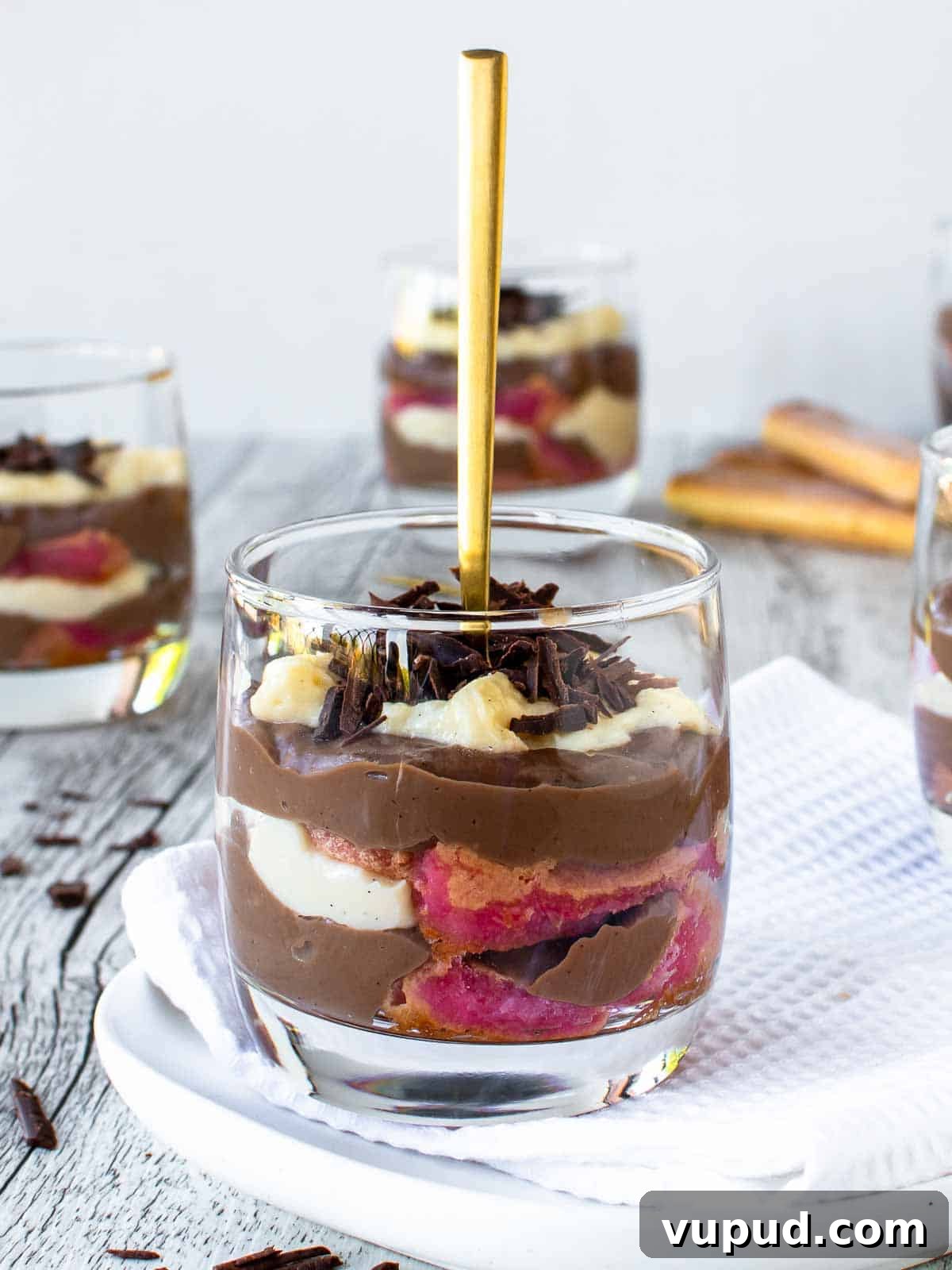 Classic Zuppa Inglese Recipe: Layered Italian Custard Dessert 2 Zuppa Inglese in a glass with a gold spoon standing upright in the dessert.