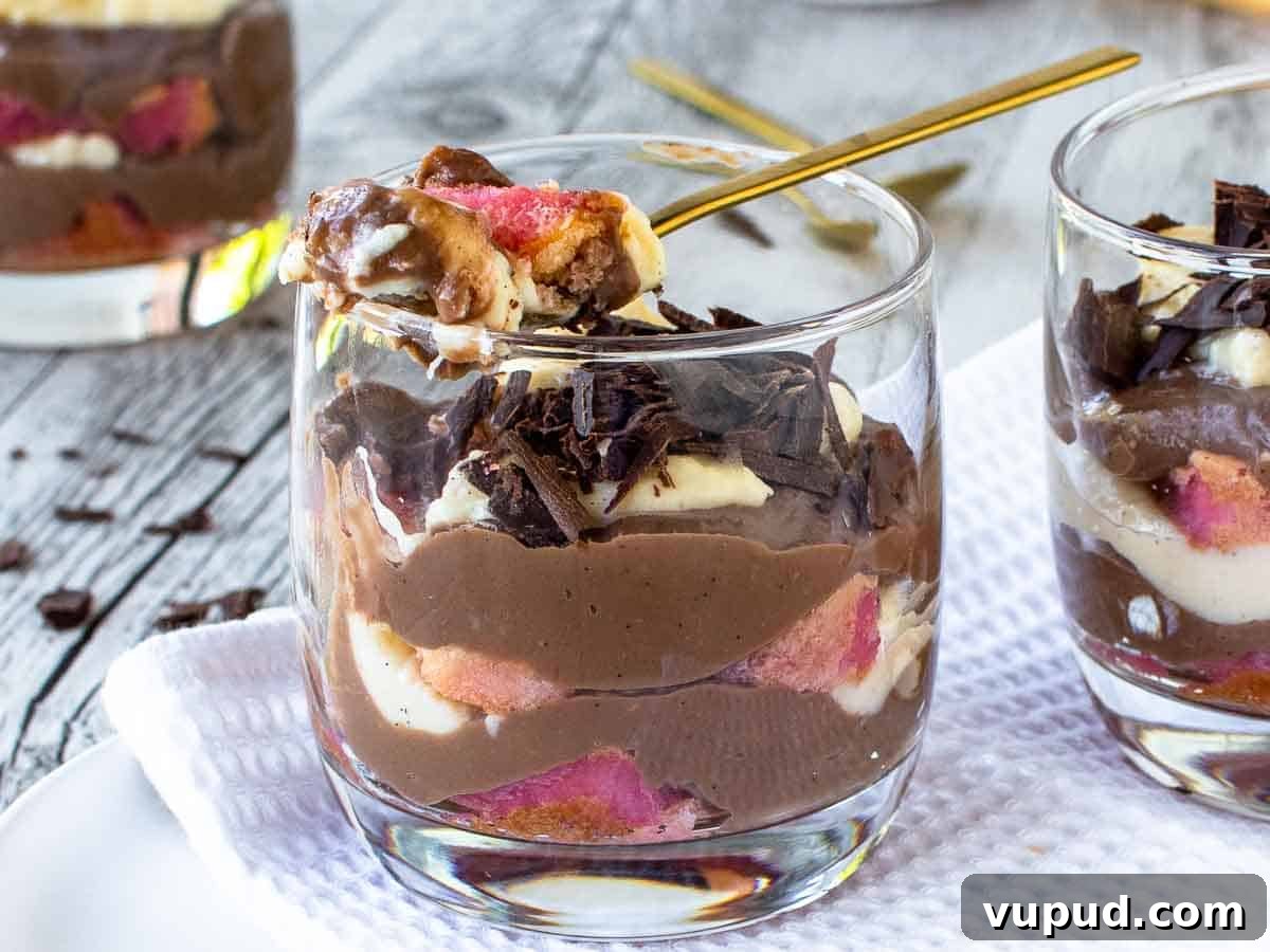 Classic Zuppa Inglese Recipe: Layered Italian Custard Dessert 6 Layered dessert in a glasses with a spoonful being taken.